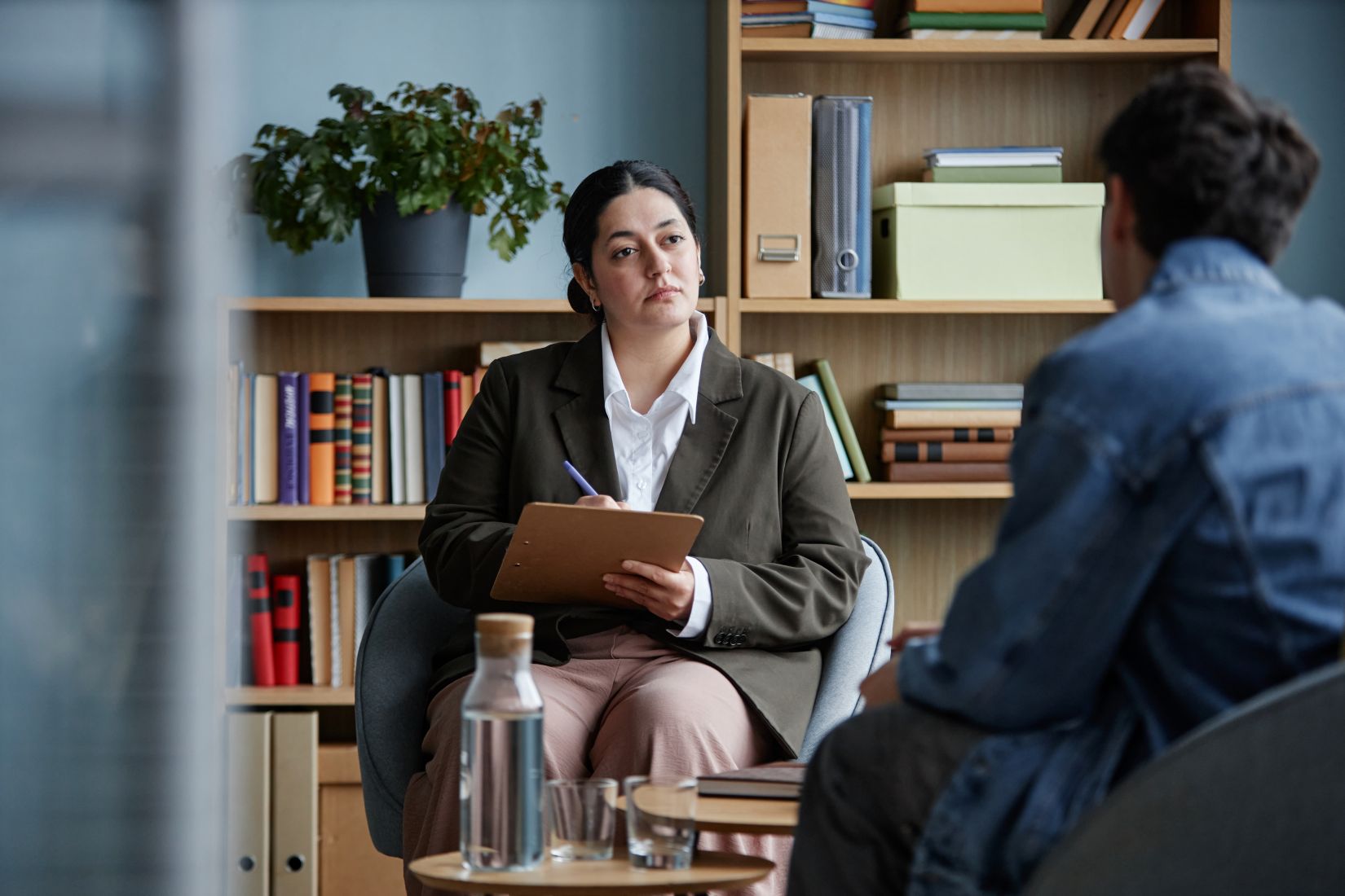 A teenage boy attending a therapy session